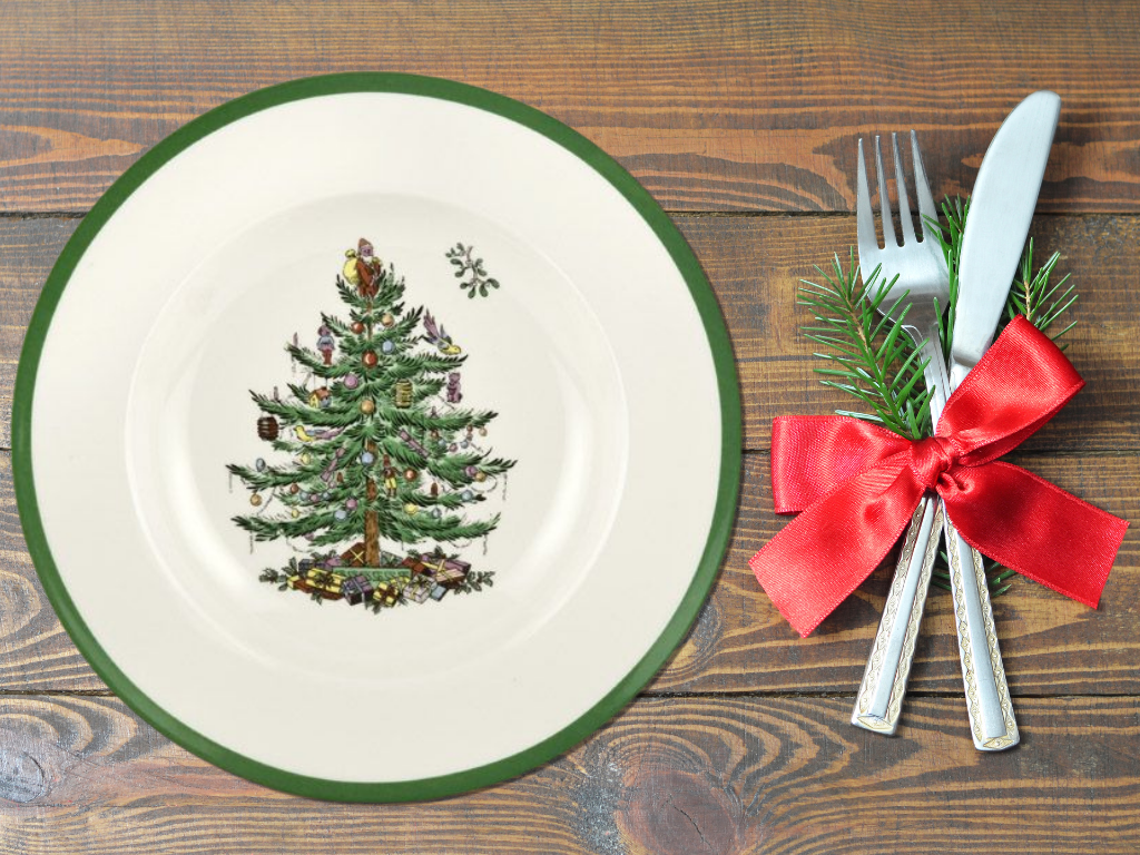 Spode Christmas dinner plate beside silverware.